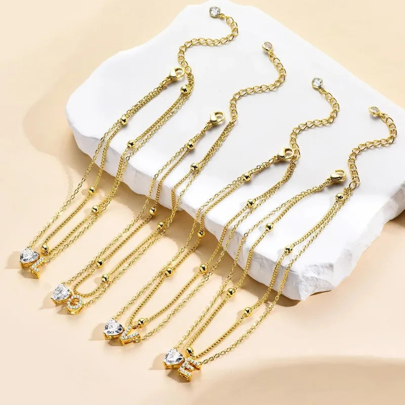 Waterproof 14K Gold Ankle Bracelets for Women, with Plated Dainty Layered Heart CZ Initial